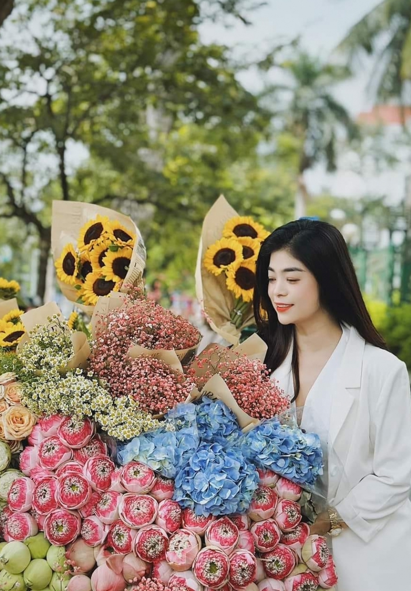 Young people in trend of check-in with flower bike on the streets